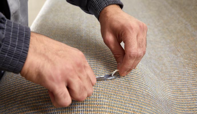 Professional carpet repairing with an equipment